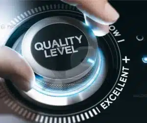 Botão de ajuste de qualidade representando excelência em inspeção industrial.